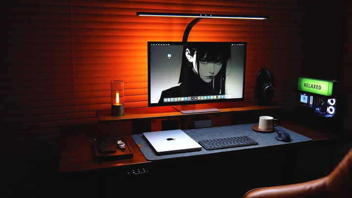 SootheForLife felt desk mat lifestyle night setup with ambient lighting for cozy workspace